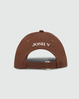 JOSH V CAP BRITT PET MET LOGO DARK BROWN